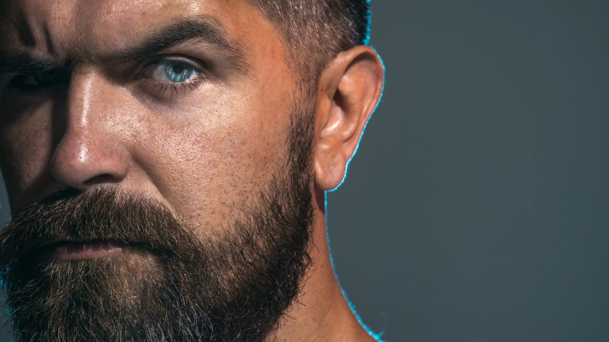 Male creator with a full beard and blue eyes